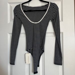 Commense striped body suit. Size small. New w tags.